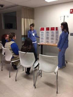 First-year student Olivia Goldschmidt and senior Rebecca Tillman play a game of “Stroke Jeopardy” with an eager group of Girl Scouts. 